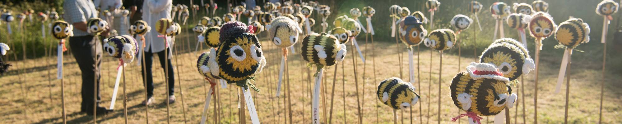 knitted bees in the organic garden for summer 2018